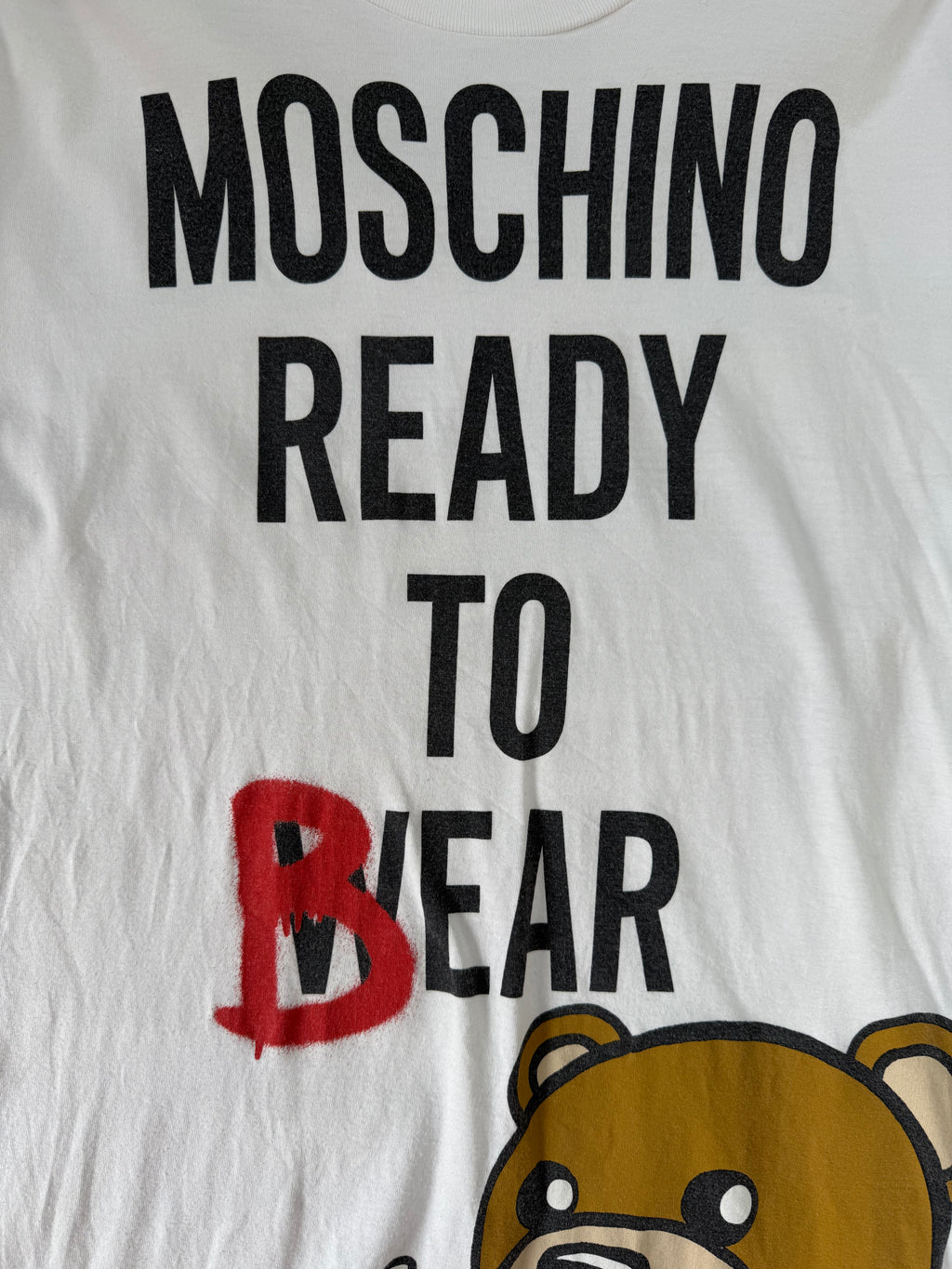 T-shirt over Moschino by Jeremy Scott