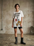 T-shirt over Moschino by Jeremy Scott